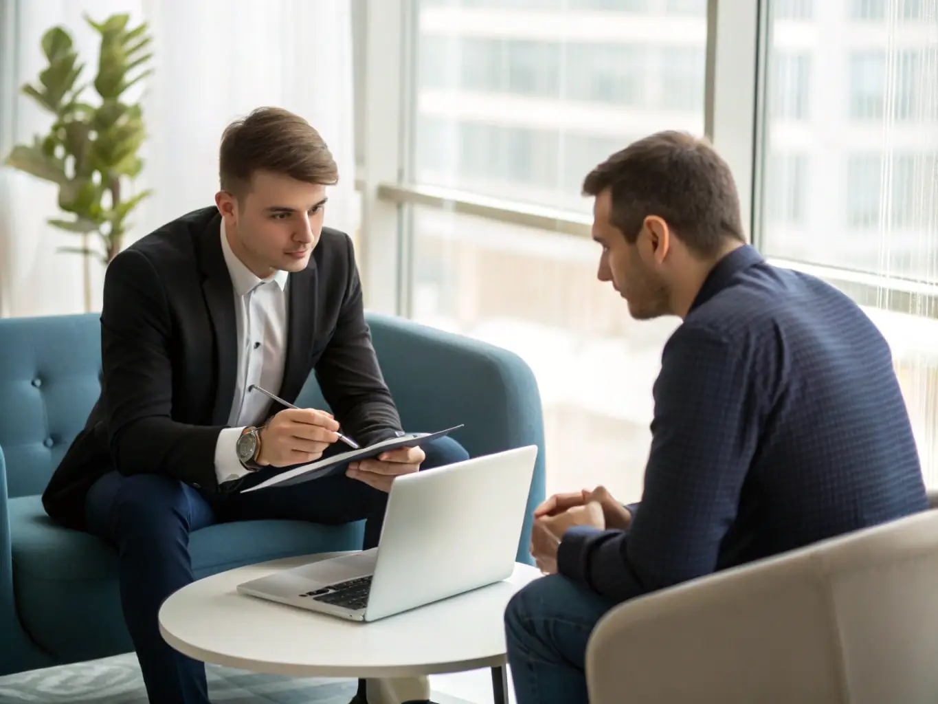 An image of a consultant discussing credit strategies with a client over a laptop, illustrating Score Ramp's personalized coaching service.